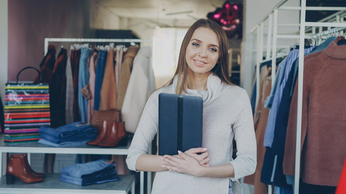 A woman stands in a clothing store