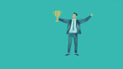 Man in suit holding a trophy with arms raised