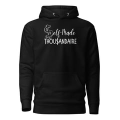 Black hoodie featuring 'Self-Made Thou$andaire' text, perfect for entrepreneurs embracing creativity and comfort.