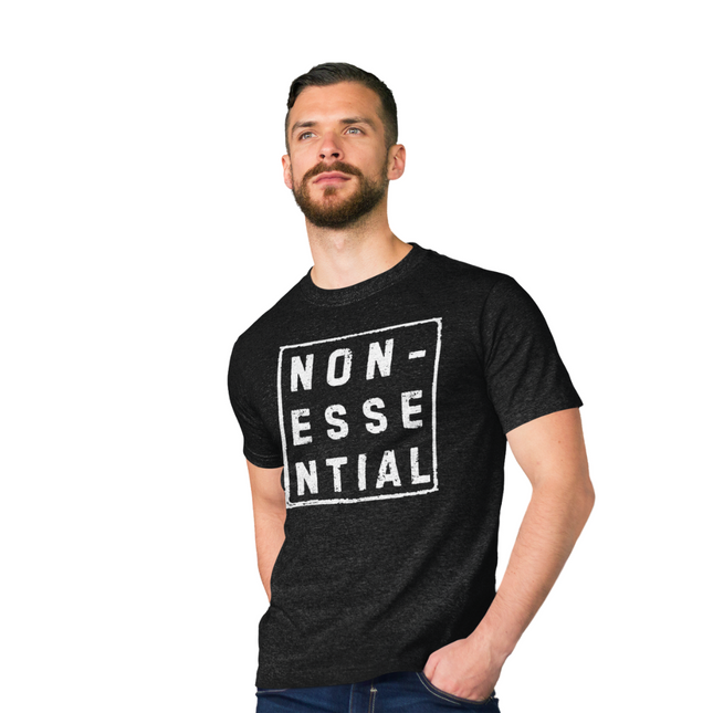 Nonessential T-Shirt – Because Who Even Makes the Rules? worn by a model in a black color.