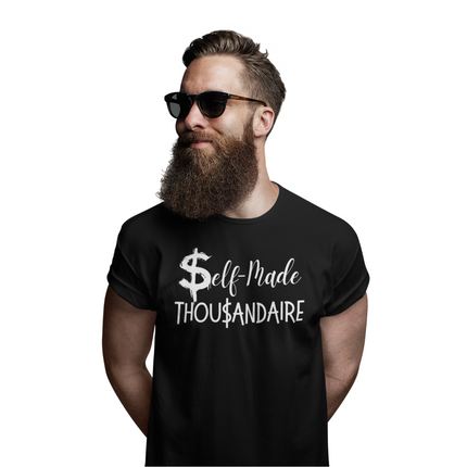 Self-Made Thousandaire T-Shirt | Entrepreneurs on the Rise worn by a stylish man with a beard and sunglasses.