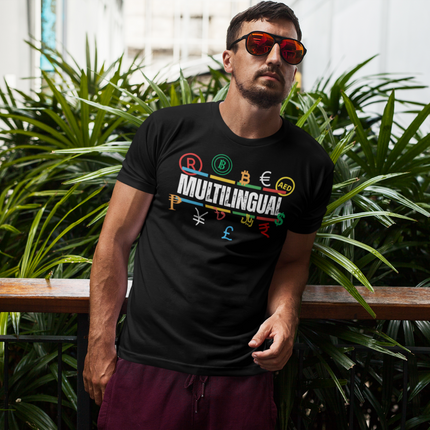 Multilingual Money T-Shirt – Speak Success in Every Language worn by a man among green plants.