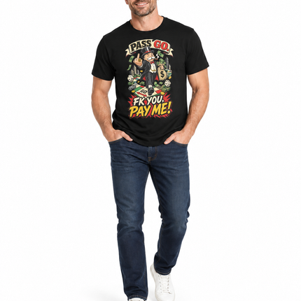 A man modeling a black graphic t-shirt with a colorful cartoon print and the text 'IF YOU PAY ME BACK I'LL PAY YOU BACK FIFTY TIMES AS MUCH AS YOU PAY ME BACK'. He is wearing dark blue jeans and white sneakers against a plain white background.