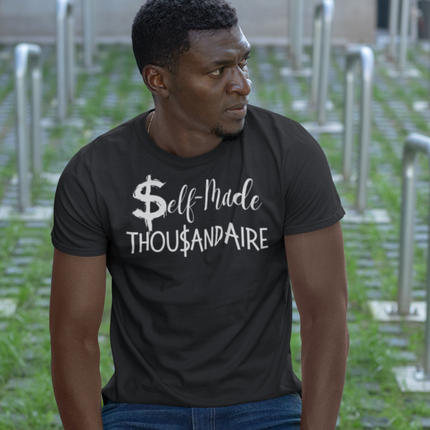 Self-Made Thousandaire T-Shirt | Entrepreneurs on the Rise worn by a man outdoors.