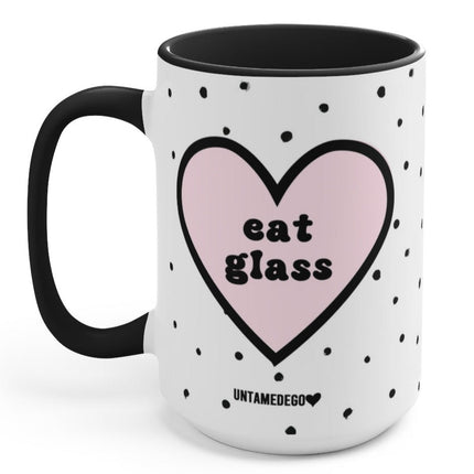 Mug with pink heart and 'eat glass' text on a white background