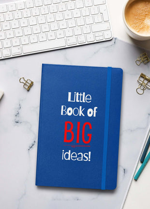 Entrepreneur Notebook - Little Book of BIG Ideas on a desk with a keyboard, cup, and stationery.