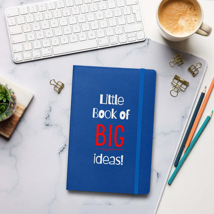 Entrepreneur Notebook - Little Book of BIG Ideas on a desk with a keyboard, cup, and stationery.