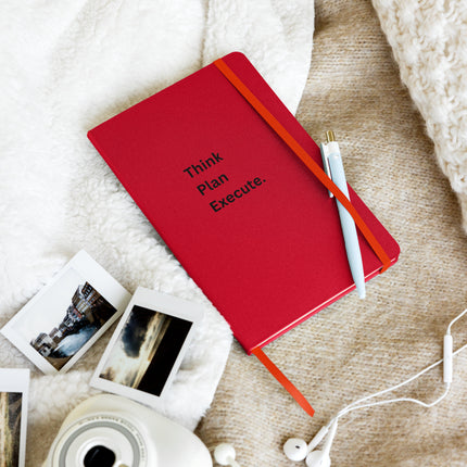 Think Plan Execute Journal – Strategic Notebook for Founders and Goal-Getters on a cozy surface with photos and a pen.