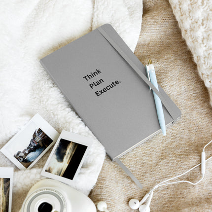 Think Plan Execute Journal – Strategic Notebook for Founders and Goal-Getters on a cozy surface with a pen and photos.