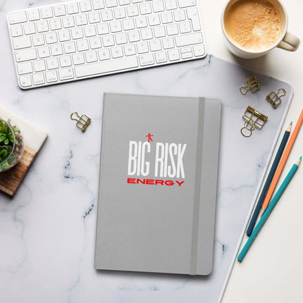 Big Risk Energy Notebook – Bold Journal for Visionaries on a marble desk with keyboard and coffee.