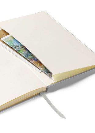 Open Big Risk Energy Notebook featuring cream-colored lined pages and a pocket for holding notes or inspiration.
