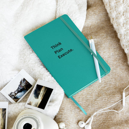 Think Plan Execute Journal – Strategic Notebook for Founders and Goal-Getters on a cozy surface with photos and pen.