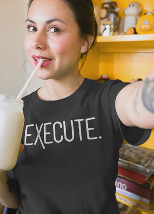Woman sipping a milkshake in a black EXECUTE T-Shirt, representing entrepreneur apparel and action-oriented mindset.