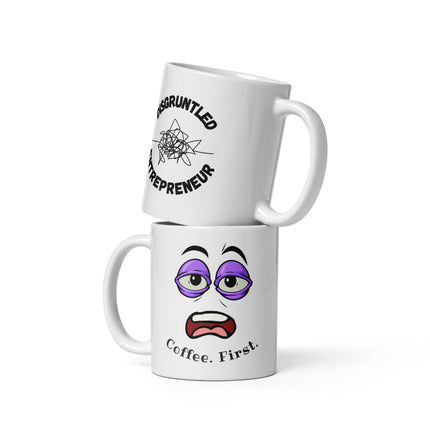 Coffee First Mug for Entrepreneurs featuring a cartoon face design and text that says 'Coffee. First.' on a white ceramic mug.